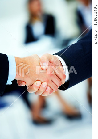 close up of business people shaking hands 139621491