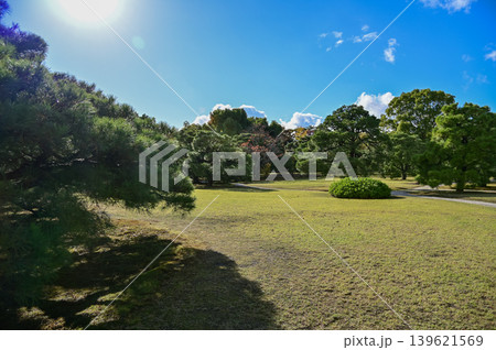 The Japanese garden view of nijo jo castle, Kyoto, Japan. World Heritage Site, Japanese old traditional architecture in Kyoto, Japan. Background landscape of the beauty of Nijo Castle at sunny day. The Japanese garden view of nijo jo castle, Kyoto, Japan. World Heritage Site, Japanese old traditional architecture in Kyoto, Japan. Background landscape of the beauty of Nijo Castle at sunny day. 139621569