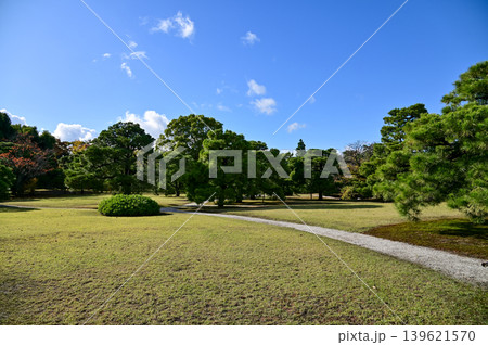 The Japanese garden view of nijo jo castle, Kyoto, Japan. World Heritage Site, Japanese old traditional architecture in Kyoto, Japan. Background landscape of the beauty of Nijo Castle at sunny day. The Japanese garden view of nijo jo castle, Kyoto, Japan. World Heritage Site, Japanese old traditional architecture in Kyoto, Japan. Background landscape of the beauty of Nijo Castle at sunny day. 139621570