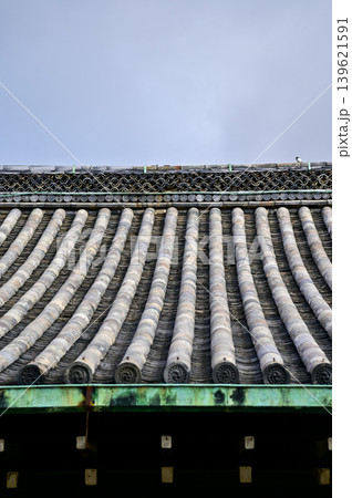 The roof of nijo jo castle, Kyoto, Japan. World Heritage Site. Roof tile pattern. Major tourist attraction in Kansai region in Japan. Japan famous historic architecture. Building exterior. The roof of nijo jo castle, Kyoto, Japan. World Heritage Site. Roof tile pattern. Major tourist attraction in Kansai region in Japan. Japan famous historic architecture. Building exterior. 139621591