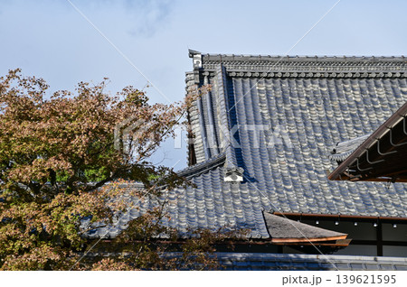 The roof of nijo jo castle, Kyoto, Japan. World Heritage Site. Roof tile pattern. Major tourist attraction in Kansai region in Japan. Japan famous historic architecture. Building exterior. The roof of nijo jo castle, Kyoto, Japan. World Heritage Site. Roof tile pattern. Major tourist attraction in Kansai region in Japan. Japan famous historic architecture. Building exterior. 139621595