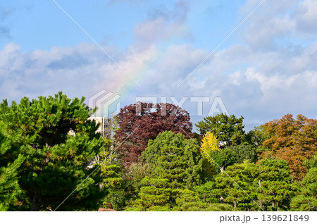 Rainbow on the sky from the view of nijo jo castle, Kyoto, Japan. World Heritage Site. Major tourist attraction in Kansai region in Japan. Japan famous historic architecture. Nature scene. Rainbow on the sky from the view of nijo jo castle, Kyoto, Japan. World Heritage Site. Major tourist attraction in Kansai region in Japan. Japan famous historic architecture. Nature scene. 139621849