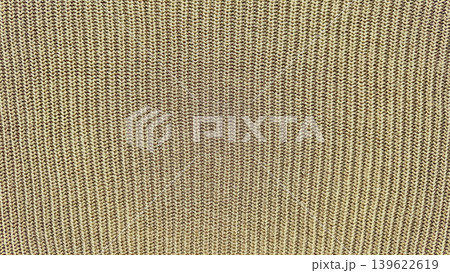 beige ribbed knit fabric macro texture evoking cozy warmth in detailed closeup view beige ribbed knit fabric macro texture evoking cozy warmth in detailed closeup view 139622619