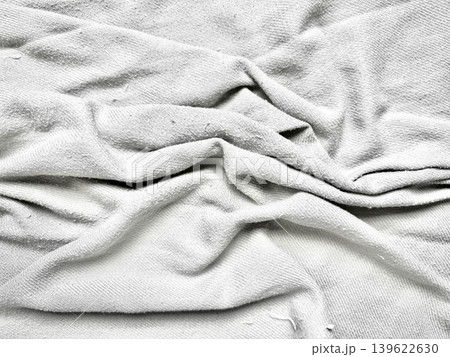crumpled white fabric folds texture abstract closeup serene minimalism 139622630