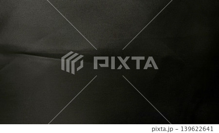 folded black mesh fabric closeup texture subtle dots evoking mysterious depth sleek modern elegance folded black mesh fabric closeup texture subtle dots evoking mysterious depth sleek modern elegance 139622641