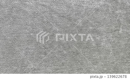gray denim texture closeup revealing twill weave faded grains and vintage rugged charm 139622678