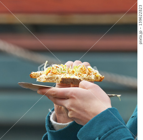 Hands holding artisan toast street food at Prague market Hands holding artisan toast street food at Prague market 139622823