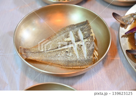 Pan Fried Flounder Served in Traditional Korean Brass Bowl Pan Fried Flounder Served in Traditional Korean Brass Bowl 139623125