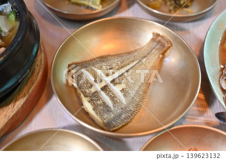 Pan Fried Flounder Served in Traditional Korean Brass Bowl Pan Fried Flounder Served in Traditional Korean Brass Bowl 139623132