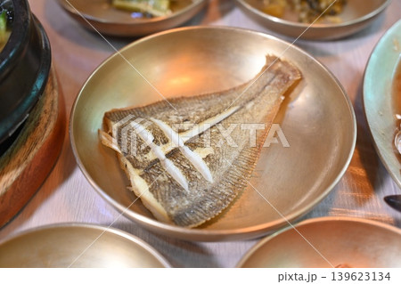 Pan Fried Flounder Served in Traditional Korean Brass Bowl Pan Fried Flounder Served in Traditional Korean Brass Bowl 139623134