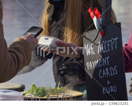 Contactless mobile payment at Naplavka street food market stall Contactless mobile payment at Naplavka street food market stall 139623281