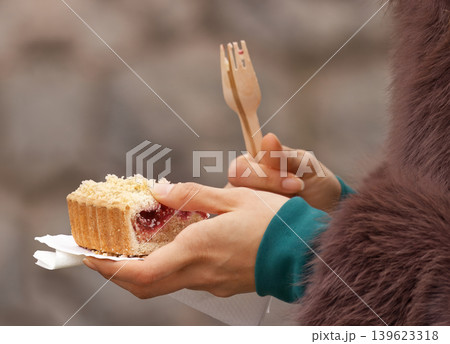 Woman Holding Cherry Cake at Naplavka Market 139623318