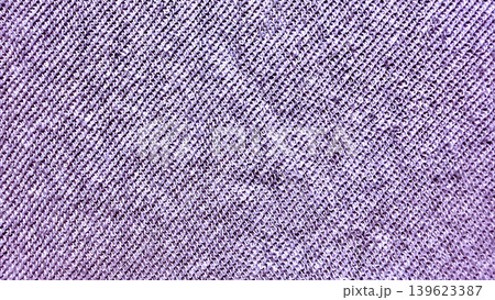 purple knitted fabric macro texture revealing soft lavender yarn loops in intricate diagonal weave pattern purple knitted fabric macro texture revealing soft lavender yarn loops in intricate diagonal weave pattern 139623387