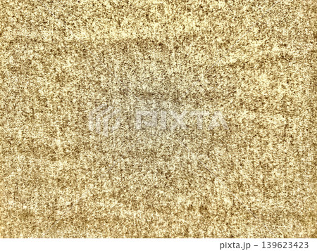 golden sand granular texture macro abstract with subtle central faded pattern in warm earthy tones 139623423