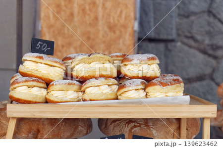 Fresh cream filled pastries at Prague farmers market stall Fresh cream filled pastries at Prague farmers market stall 139623462