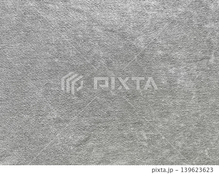 gray denim texture macro view of intricate twill fabric with detailed threads and natural surface variations gray denim texture macro view of intricate twill fabric with detailed threads and natural surface variations 139623623