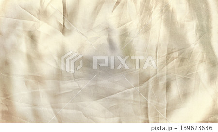 crumpled gingham fabric macro closeup texture reveals intricate folds soft shadows and serene beige atmosphere 139623636