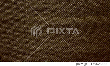 earthy brown twill denim fabric texture macro closeup reveals intricate diagonal weave pattern natural tactile folds earthy brown twill denim fabric texture macro closeup reveals intricate diagonal weave pattern natural tactile folds 139623656