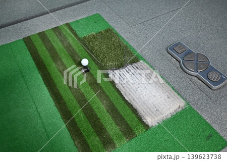 Indoor Golf Simulator Mat with Ball on Tee and Control Panel Indoor Golf Simulator Mat with Ball on Tee and Control Panel 139623738