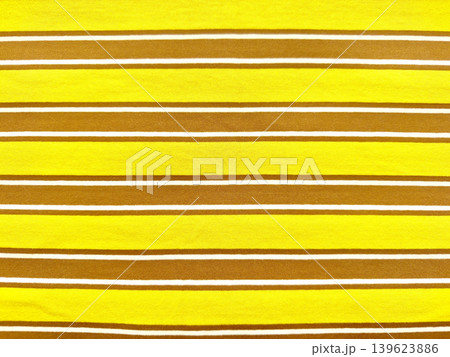 vibrant yellow and mustard brown striped jersey fabric texture with crisp white accents in sharp macro detail vibrant yellow and mustard brown striped jersey fabric texture with crisp white accents in sharp macro detail 139623886