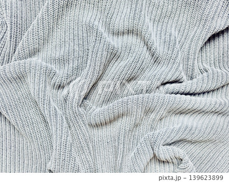 soft gray ribbed knit sweater casually crumpled in cozy natural folds evoking minimalist wellness comfort soft gray ribbed knit sweater casually crumpled in cozy natural folds evoking minimalist wellness comfort 139623899