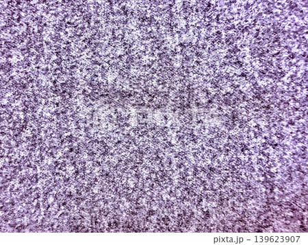 vibrant purple shaggy carpet macro texture highlighted by white arrow pointing to detailed center spot 139623907