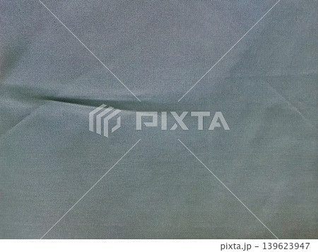 blue gray fabric texture drapes softly with natural wrinkle revealing intricate weave in minimalist serenity 139623947