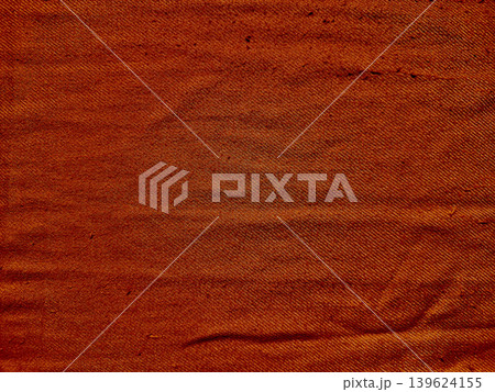 wrinkled rust orange woven fabric texture reveals intricate threads and soft natural folds wrinkled rust orange woven fabric texture reveals intricate threads and soft natural folds 139624155