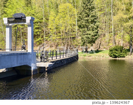 Stone Archway With Peaceful Surroundings. Heritage Park Features Charming Pier With Classical Structures Stone Archway With Peaceful Surroundings. Heritage Park Features Charming Pier With Classical Structures 139624367