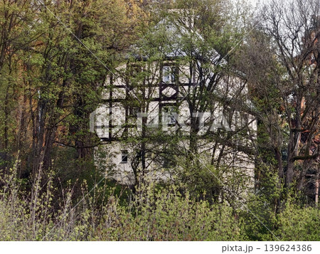 Old Forest House With Moss. Abandoned Cottage Surrounded By Dense Trees And Creeping Plants 139624386