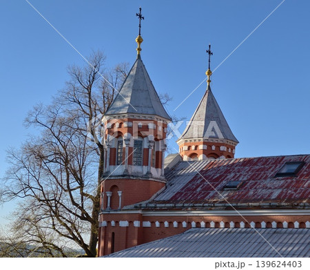 Historical Brick Church With Leafless Tree Silhouette And Aerial Imaging Exploration Potential 139624403