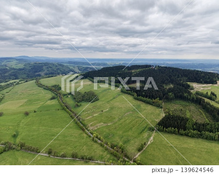 Pastoral Scene With Hills And Hedges. Overcast Sky Over Rolling Pastures And Rural Farmland Landscape Pastoral Scene With Hills And Hedges. Overcast Sky Over Rolling Pastures And Rural Farmland Landscape 139624546