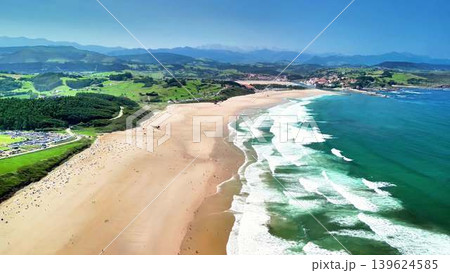 Experience a breathtaking aerial view showcasing a stunning beach and picturesque coastline Experience a breathtaking aerial view showcasing a stunning beach and picturesque coastline 139624585