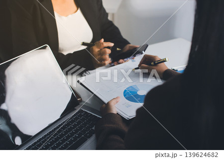 Accountants processing financial documents and taxes, managing corporate finance in a modern office. Audit and taxes in business Accountants processing financial documents and taxes, managing corporate finance in a modern office. Audit and taxes in business 139624682