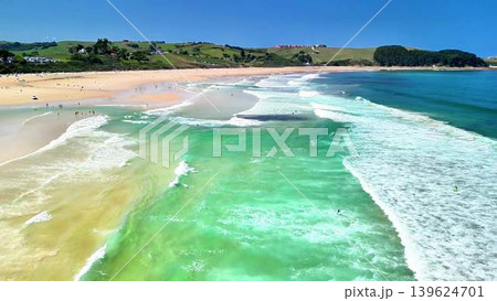 Stunning Aerial View Showcasing a Vibrant Beach with Crystal Clear Waters and Gentle Waves 139624701