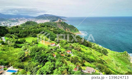 This breathtaking coastal landscape features lush greenery, serene waters, and beautiful views This breathtaking coastal landscape features lush greenery, serene waters, and beautiful views 139624713