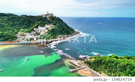 Experience a breathtaking aerial view of a stunning coastal paradise with vibrant waters Experience a breathtaking aerial view of a stunning coastal paradise with vibrant waters 139624719