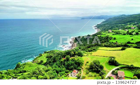 Experience Stunning Aerial Views Showcasing a Lush Coastal Landscape and a Tranquil Ocean Experience Stunning Aerial Views Showcasing a Lush Coastal Landscape and a Tranquil Ocean 139624727