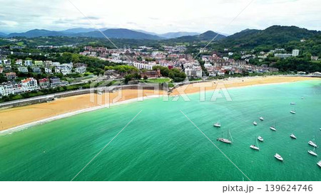 Witness a Stunning Aerial View of a Coastal Town Surrounded by Beautiful Turquoise Waters Witness a Stunning Aerial View of a Coastal Town Surrounded by Beautiful Turquoise Waters 139624746