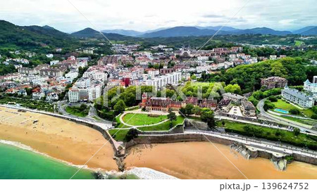 A breathtaking aerial view showcasing a stunning beach alongside a beautiful city landscape A breathtaking aerial view showcasing a stunning beach alongside a beautiful city landscape 139624752