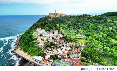 A Coastal Village Overlooking the Beautiful Ocean and Lush, Verdant Greenery Surrounding It 139624762