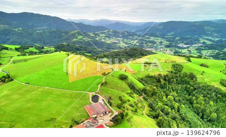 Breathtaking and Scenic Aerial View of Lush Green Hills and Picturesque Valleys Below Breathtaking and Scenic Aerial View of Lush Green Hills and Picturesque Valleys Below 139624796