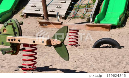 A Joyful and Playful Spring Toy Designed for Children at a Vibrant Colorful Playground A Joyful and Playful Spring Toy Designed for Children at a Vibrant Colorful Playground 139624846