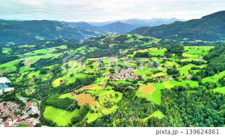 Enjoy this breathtaking aerial view of the lush green landscape and captivating rolling hills 139624861