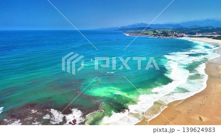 Experience the breathtaking coastal aerial view of serene ocean waves undulating gracefully Experience the breathtaking coastal aerial view of serene ocean waves undulating gracefully 139624983