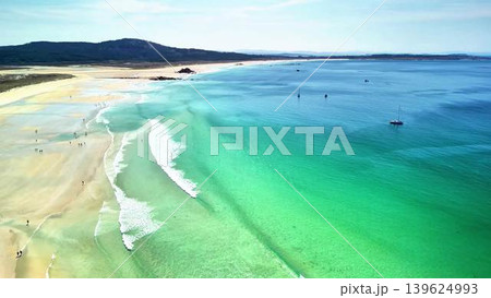 A beautiful scenic beach with crystal clear waters and soft, inviting sands to enjoy A beautiful scenic beach with crystal clear waters and soft, inviting sands to enjoy 139624993