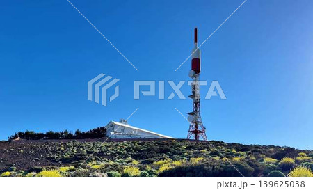 A tall telecom tower stands in a scenic landscape, showcasing advancements in communication A tall telecom tower stands in a scenic landscape, showcasing advancements in communication 139625038