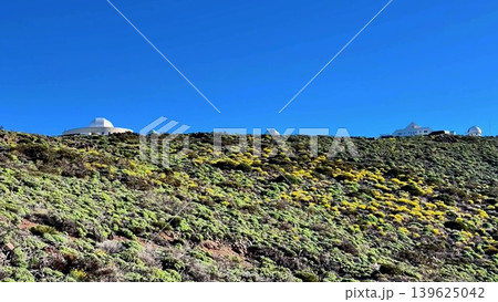 A stunning scenic view of a captivating mountainous landscape featuring scientific observatories 139625042