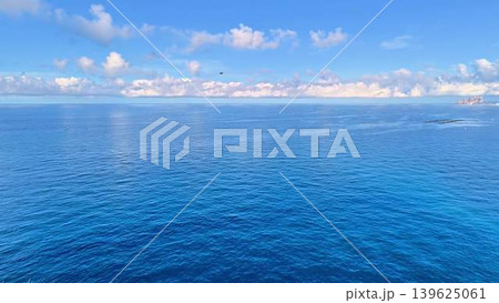 Enjoy a Serene Ocean View with Clear Blue Skies and Gentle Waves that inspire tranquility 139625061