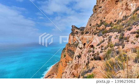 A Stunning Coastal Cliff with a Vibrant Ocean View, Perfect for an Adventurous Escape A Stunning Coastal Cliff with a Vibrant Ocean View, Perfect for an Adventurous Escape 139625062